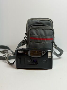 black Ricoh S-30 compact 35mm point-and-shoot film camera with a 35mm lens
